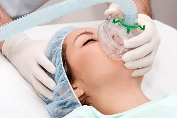 Medical professional explaining anesthesia terms to patient